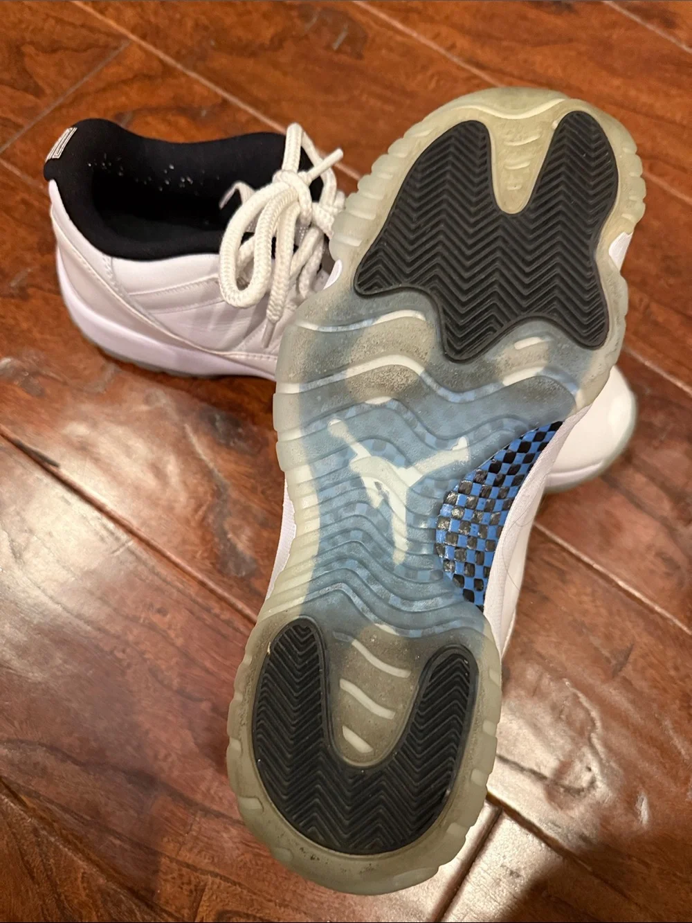 Jordan Men's White and Black Low-Top Sneakers with Blue Tongue Accent